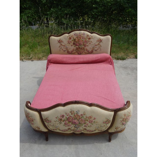 Stunning Louis XV style double bed dating from the 1950s, crafted from solid wood. This model is ideal for adding a retro...