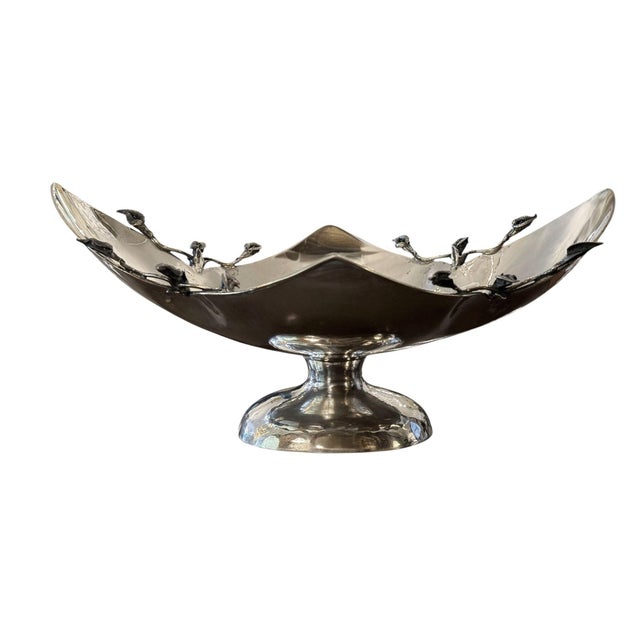 An elegant pair of late 20th century sterling silver centerpiece bowls by Damar, each distinguished by a dramatic...