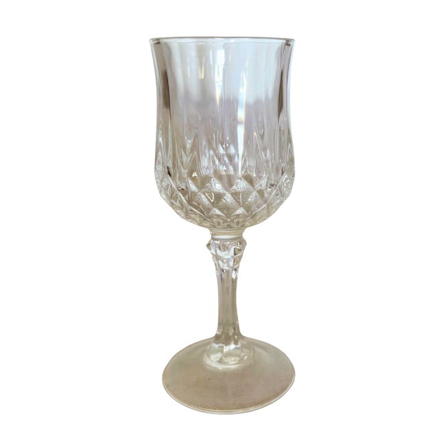 A timeless french table service by cristal d’arques in the iconic longchamp pattern, celebrated for its brilliant diamond-...