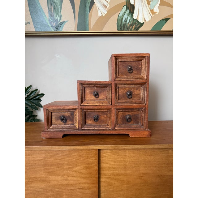 Very unique and beautiful solid wood mini chest of drawers resembling an apothecary style chest or a Japanese Kaiden Tansu...