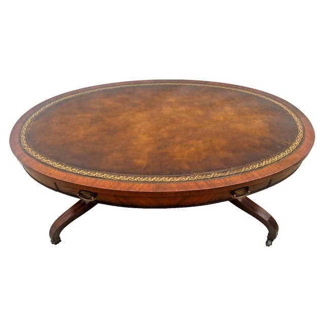 Gorgeous vintage oval coffee table by premier maker Weiman. Masterfully crafted from rich mahogany with striking flame...