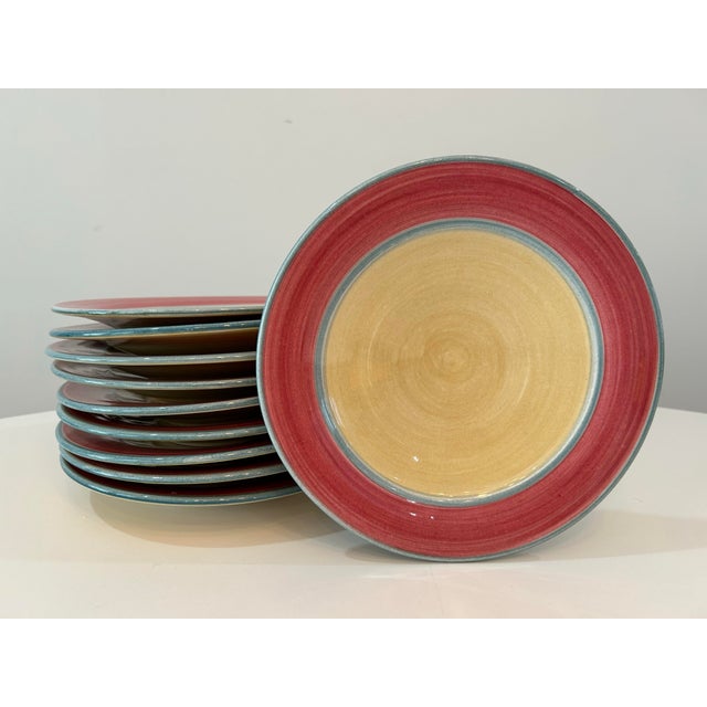 Lovely, colorful Ann Mallory California Pottery set of 10 medium plates (9 3/8”). Features jade and raspberry colors over...