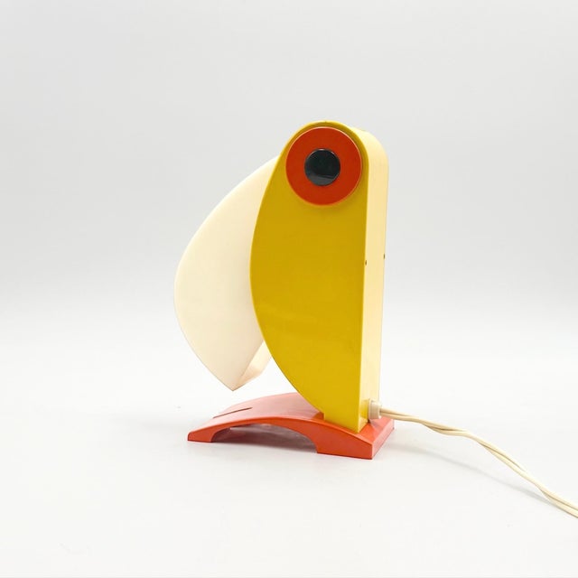 A rare Toucan model table light designed by Enea Ferrari and produced by Old Timer Ferrari in Italy during the 1970s. An...