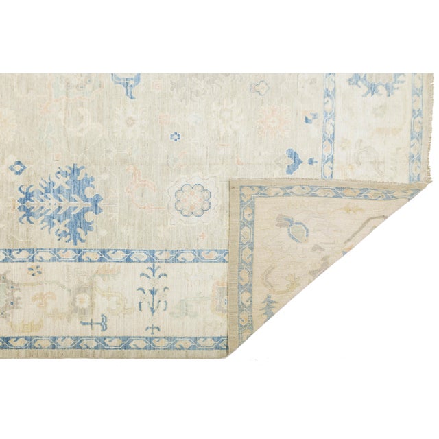 Elevate your space with the elegance of this Modern Oushak Style rug. Hand-knotted from premium wool, it features a low-...