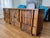 Mid-century modern long dresser by Lane for their "Pueblo" series. Adorned with mosaic style wood collage, making a...