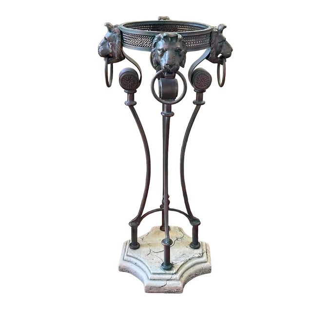 Bring sculptural elegance to your interior with this distinctive Neoclassical-style plant stand. A circular openwork...