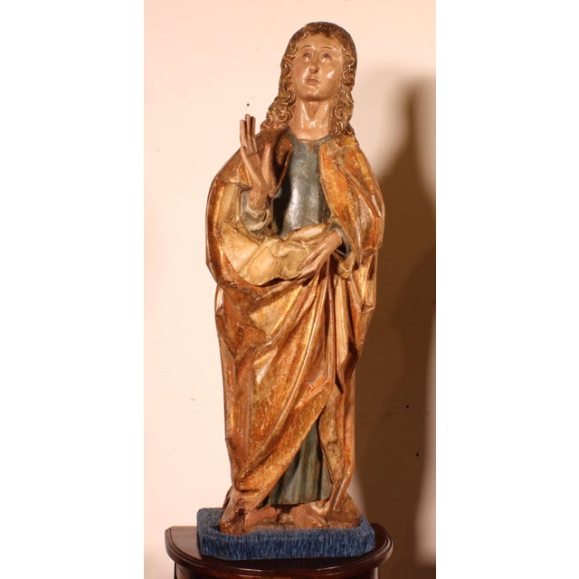 Saint John the Baptist and the Virgin Mary from a Crucifixion Group, Spain, circa 1500, in walnut. Superb pair of gilt and...