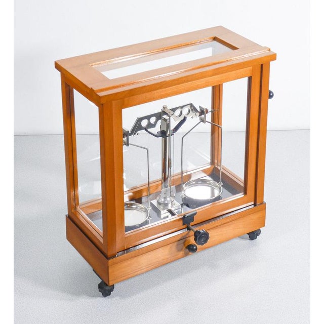 Precision pharmacy scale, wood and glass case, with plate lifting mechanism and drawer. Origin italy period 20th century...