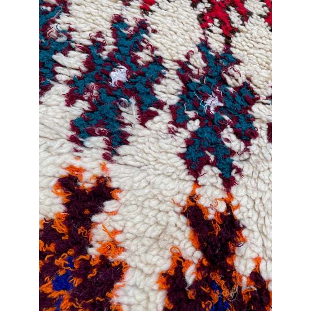 Hand-woven by the Berber women in the Atlas Mountains, this Vintage rug is created with soft natural wool fibers from the...