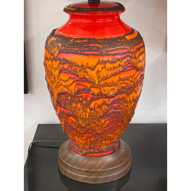 A great pair of vintage ceramic lamps in a Lava Glaze. Bright orange and red, these have just been re-wired with new...