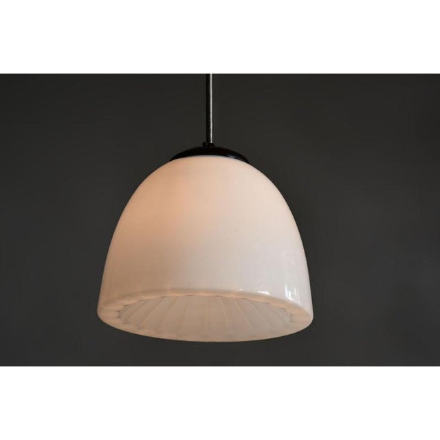 This original pendant chandelier, originating from the 1960s, represents a magnificent example of Czechoslovak design...