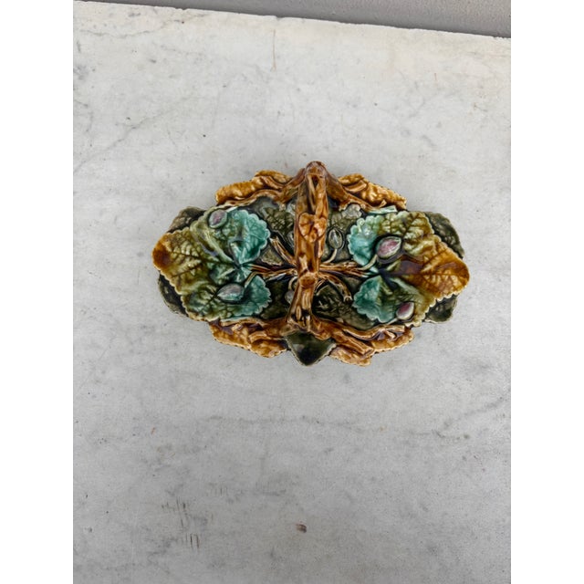 Small 19th Century French Majolica basket leaves & berries signed Choisy le Roi. H / 3.8 inches , 7.2 by 4.5 inches.