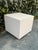 This postmodern minimalist side table features clean lines and a super cute blush pink laminate. The perfect pedestal for...