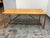 Design Plus Gallery presents the Strut Wood Dining Table in Walnut by Blu Dot. The table pairs a rectangular walnut veneer...