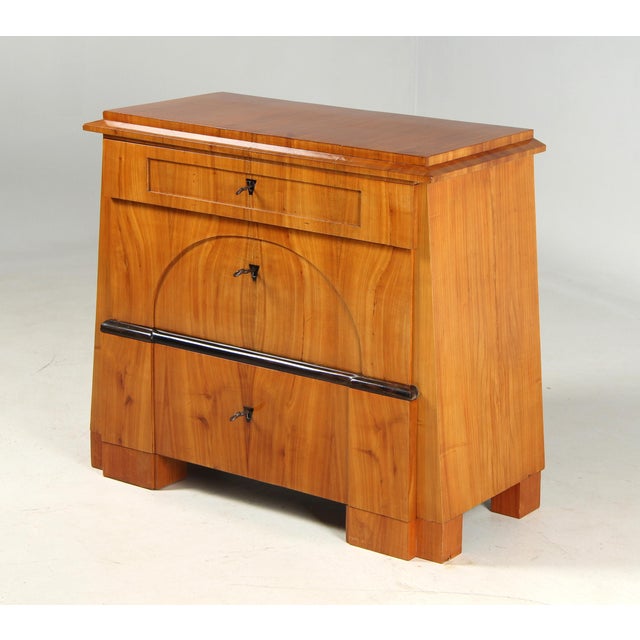 Antique Biedermeier Chest of Drawers in a Tapered Form Thuringia–Brandenburg Cherrywood Circa 1825 Dimensions: H × W × D:...
