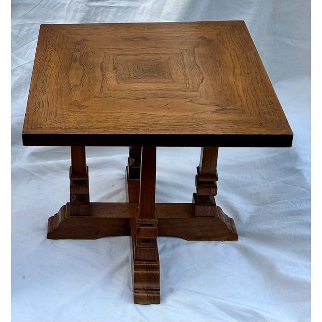 Two's company! Crafted in high quality by Thomasville Furniture, this pair of vintage Hollywood Regency square end tables...