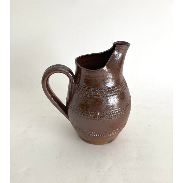 This vintage 1950s salt glazed pitcher is in perfect condition with the imprint for Gres du Berry / Fait Main / Made in...