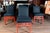 James Mont style set of 12 Moderne red lacquered wood dining chairs with black upholstery. Two arm chairs and ten side...