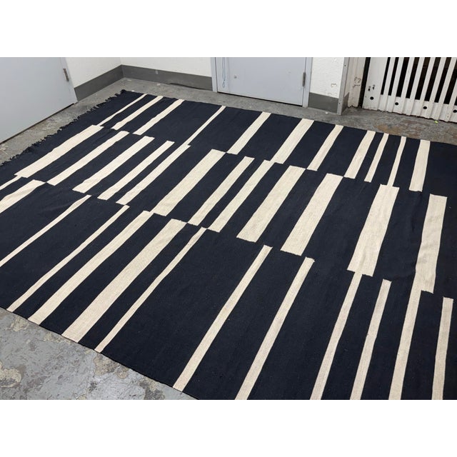 Design Plus Gallery presents the 8ft 9in × 12ft 3in Willow Offset Black Stripe Cotton Rug from Four Hands. This flatwoven...