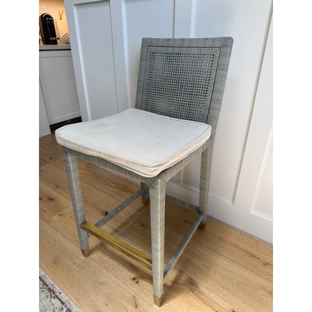 Up for sale are four, authentic Serena & Lily Balboa Rattan Counter Stools. These pieces beautifully blend clean,...