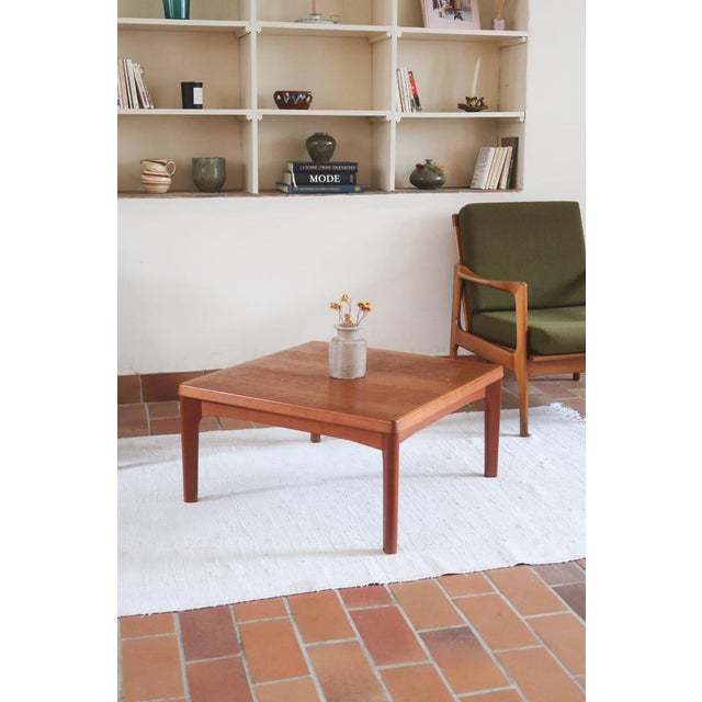 A Danish coffee table in solid teak, designed by Henning Kjærnulf for Vejle Stole og Møbelfabrik in the 1960s and stamped...