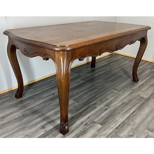 This Vintage French dining table presents a beautifully proportioned and elegant silhouette, featuring a richly grained...
