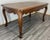 This Vintage French dining table presents a beautifully proportioned and elegant silhouette, featuring a richly grained...
