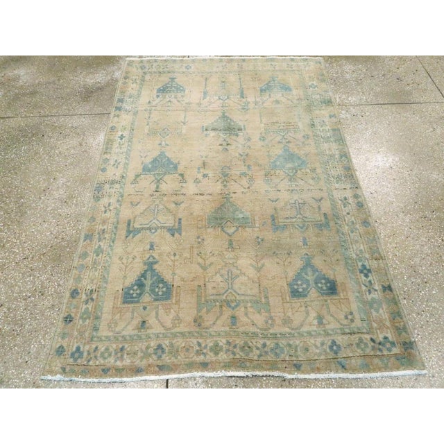 The well-abrashed straw-beige field hosts a three by five directional pattern of stepped pentagons with flowers developing...