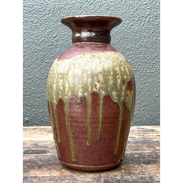 This exquisite vintage studio pottery vase captures the essence of organic modernism with its striking drip glaze and...