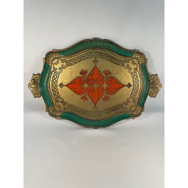 A stunning Italian Florentine Decorative Tray with a curvy rectangular shape. Circa Mid 20th Century. Made in Italy...