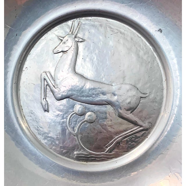 One of the most iconic, though rare, pieces ever made by Oscar Bach, this bowl features an iconic leaping stag in high Art...