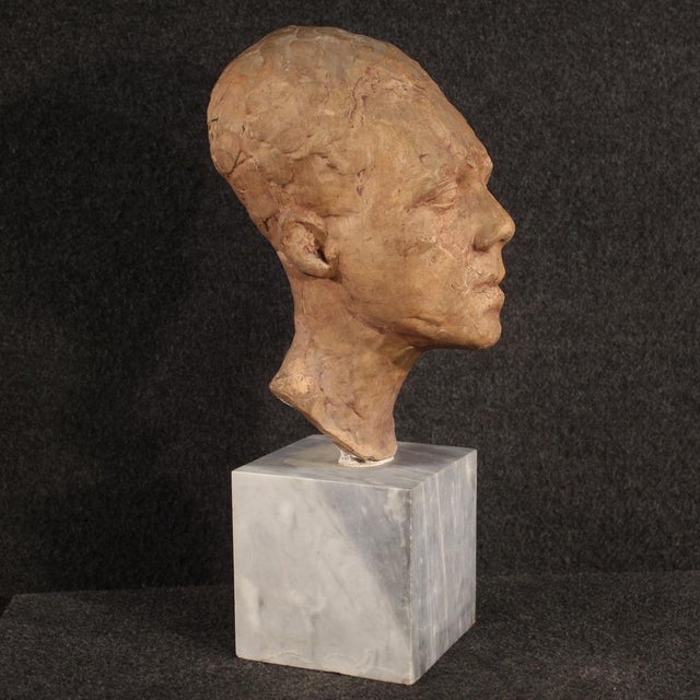 Interesting Italian sculpture from the 20th century. Terracotta object depicting a man's face of beautiful quality and...