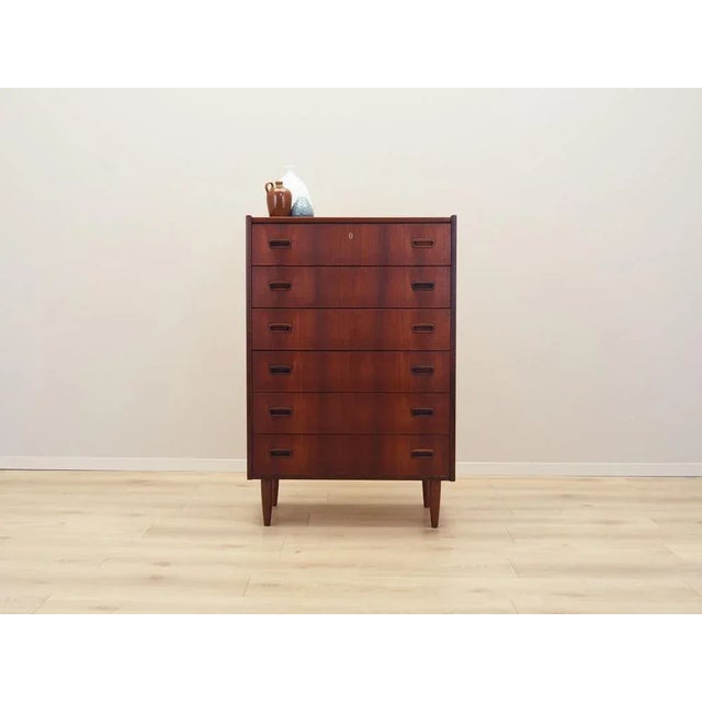 The chest of drawers was made in the 1970s, Danish production. The structure is covered with teak veneer. The legs are...