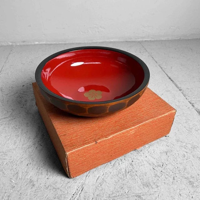 Beautiful wooden lacquerware bowls from the 1960s-70s Japan. The wooden exterior is intricately hand-carved, while the...