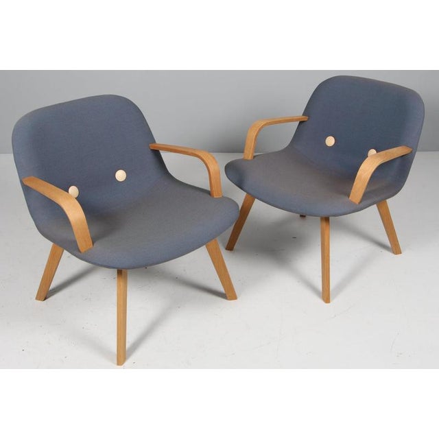 Johannes Foersom & Peter Hjorth-Lorentzen for Erik Jørgensen. Lounge Chair with wool from Kvadrat, buttons of tan full...