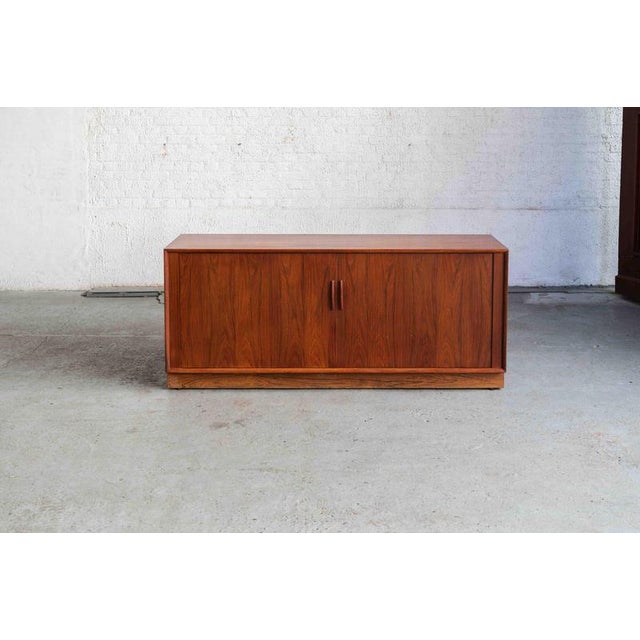 Rare low sideboard designed by Arne Vodder and produced by Sibast Møbler in the 1960s in Denmark. This credenza with...