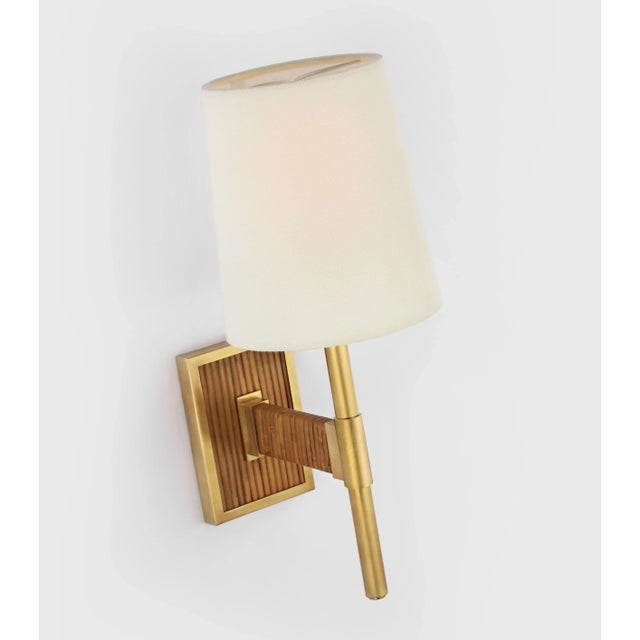 Elle Small Single Sconce in Hand-Rubbed Antique Brass and Dark Rattan with Linen Shade Designer: Suzanne Kasler Height:...