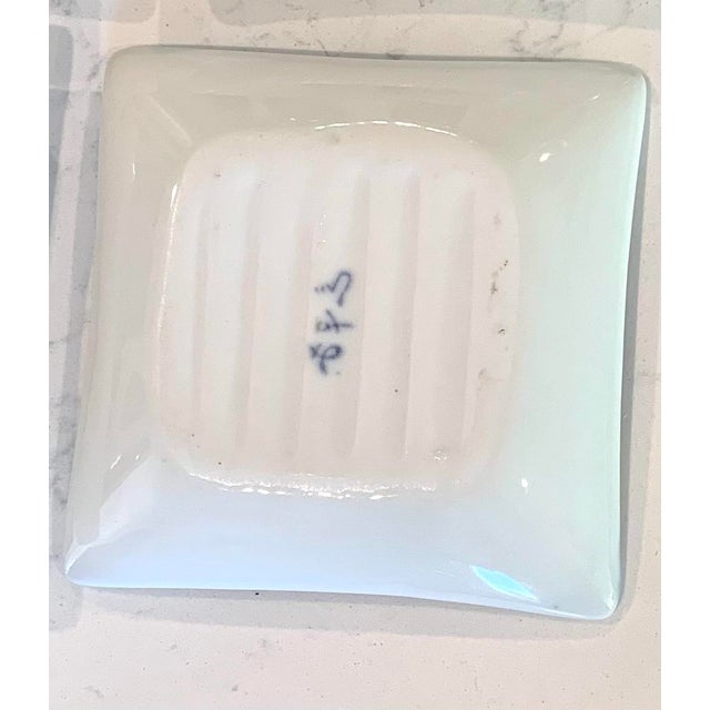 Asian sauce dipping dishes set of 4. Each dish has its own hand painted design.All are signed on the backside