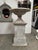 Iron urn on wooden pedestal. Total height 61". Urn is 36" wide by 21" tall. Pedestal is 26" at the base, 23" at the top,...