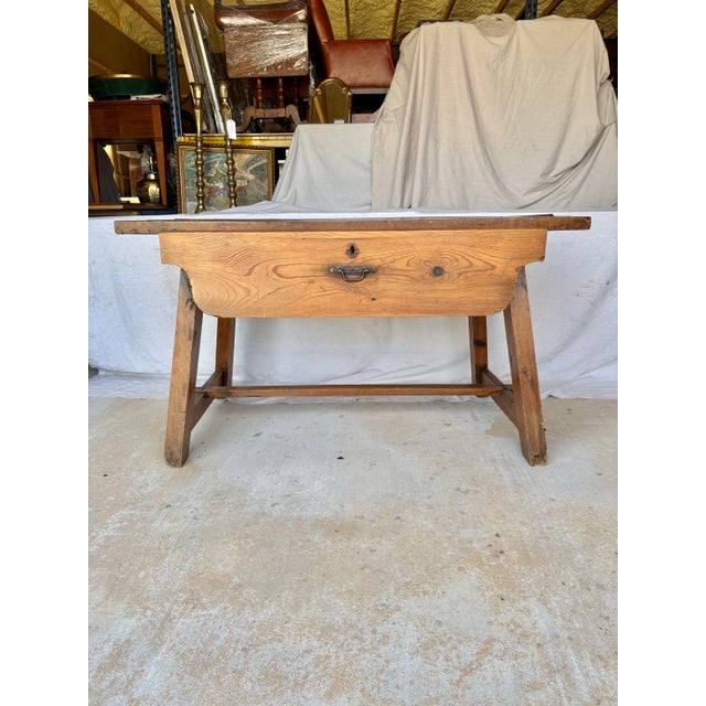 Found in the South of France, this 19th Century French Pine Side Table dates back to the late 1800's. The piece features a...