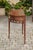 An English oak demilune console table from the mid-19th century, with tray top, single drawer and tapered legs. Born in...