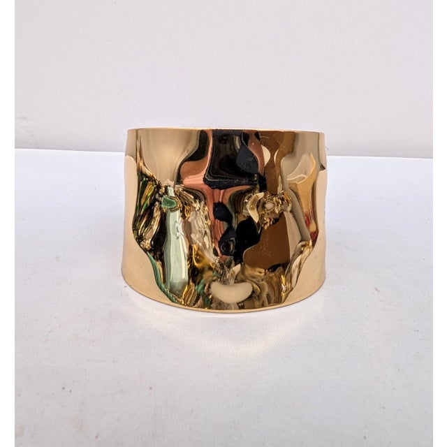 1977 goldtone wavy/bumpy slide on cuff bracelet. Marked "NAPIER©" in the center inside of the cuff near the edge....