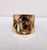 1977 goldtone wavy/bumpy slide on cuff bracelet. Marked "NAPIER©" in the center inside of the cuff near the edge....