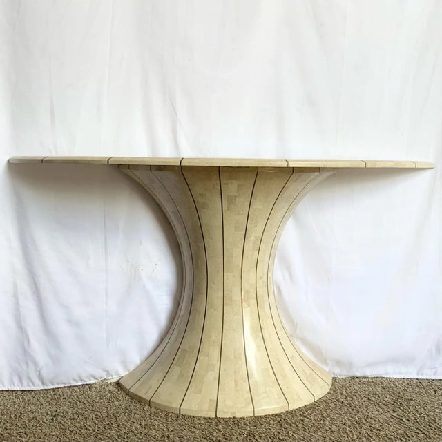 Sculptural and sophisticated, this Postmodern demilune console in the style of Maitland Smith stuns with its fan-shaped...