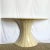 Sculptural and sophisticated, this Postmodern demilune console in the style of Maitland Smith stuns with its fan-shaped...