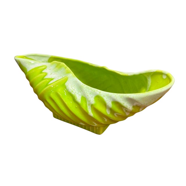 An eye-catching vintage shell-form centerpiece by Hollywood Ceramics of California, expertly hand made and finished in a...