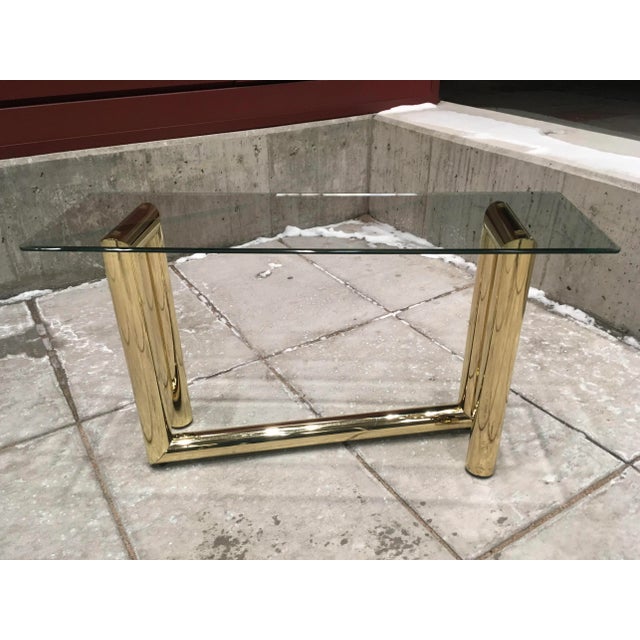 Vintage postmodern tubular brass plated “z” console or sofa table with thick beveled glass top, attributed to Karl...