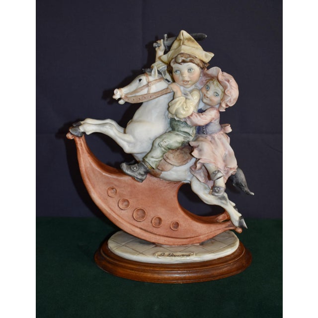 Vintage (1980's) Rocking Horse with Boy & Girl. The Artist Giuseppe Armani. The Material is Porcelain with a Muted Multi...