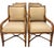 Set of six rattan dining armchairs featuring a warm honey-toned finish and tailored neutral upholstery. The sculptural...