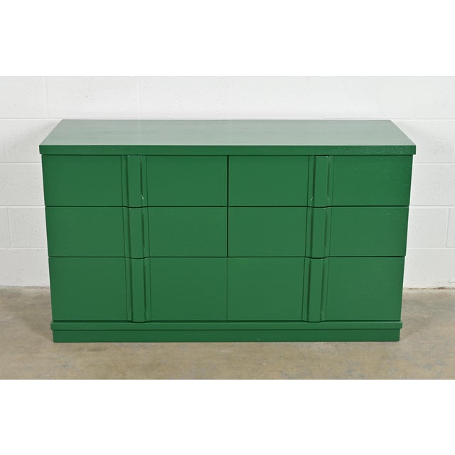 A gorgeous Art Deco or Mid-Century Modern green lacquered maple double dresser or chest of drawers In the manner of Donald...